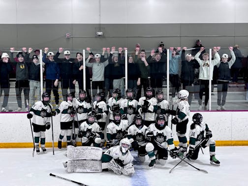 Photo of the 2026 Cottage Grove 12UB1 Hockey team after winning 15 periods of play stretching across three days in St. Paul.