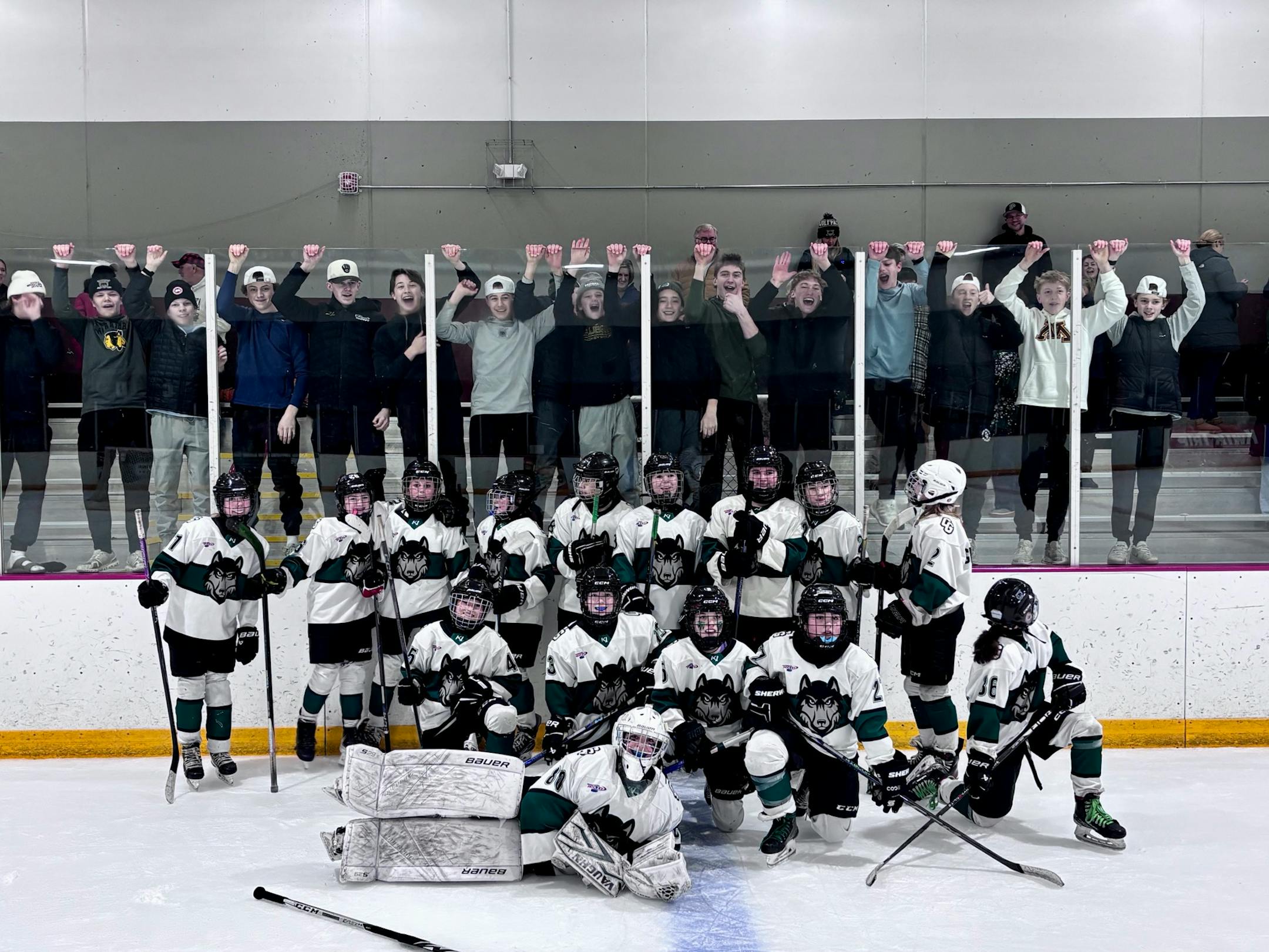 Photo of the 2026 Cottage Grove 12UB1 Hockey team after winning 15 periods of play stretching across three days in St. Paul.