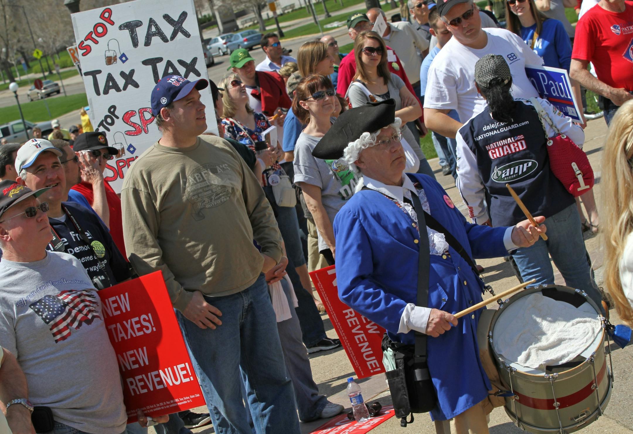 The crowd at Saturday's 2011 Tax Cut Rally held signs protesting the health care bill, the amount of government spending and taxes and the phasing out of incandescent light bulbs. The annual rally was held at the Minnesota State Capitol.