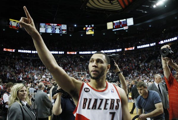 Portland Trail Blazers' Brandon Roy (7) points to the crowd after defeating the Dallas Mavericks 84-82 in Game 4 of their NBA basketball first-round p
