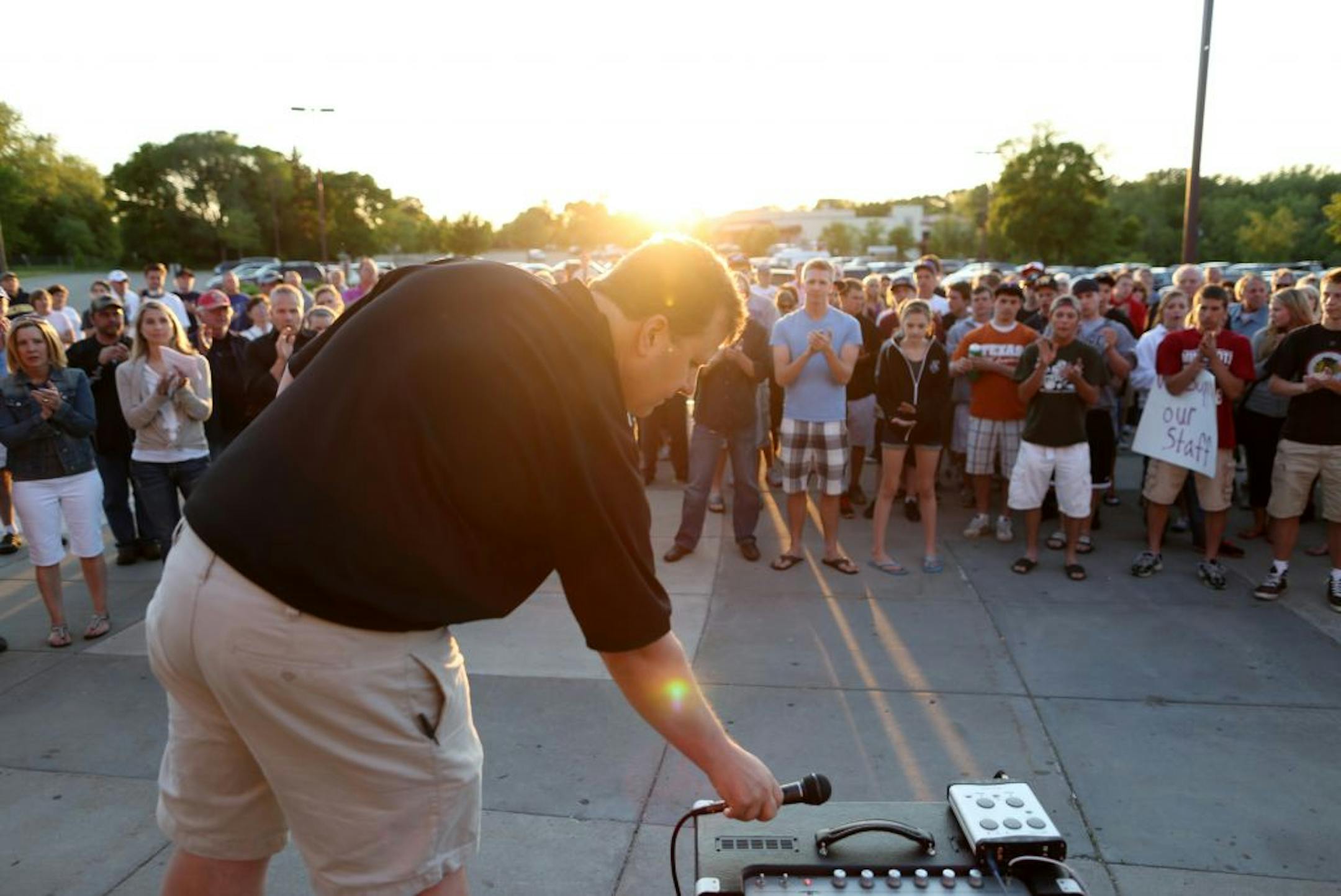 Former Roseville boys' hockey coach Jeff Pauletti, who resigned in May after allegations that he bullied kids and committed fraud, spoke to a group of supporters outside Roseville High School on May 15. Many high school coaches say the parent-coach relationship has changed.