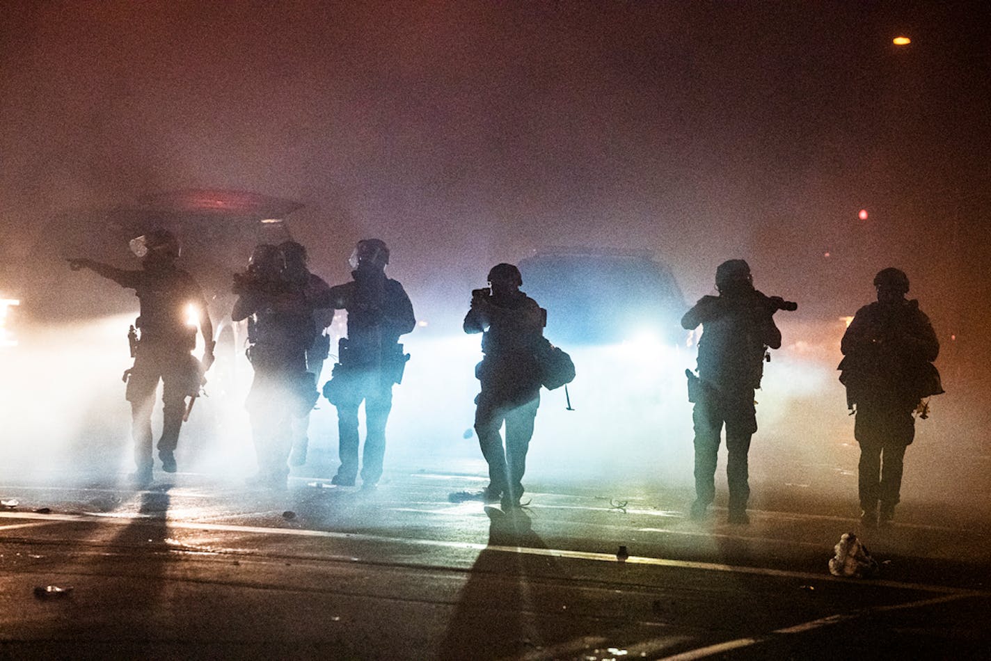 Protesters skirmished with the National Guard near the Third Precinct in south Minneapolis before heading down Lake St. toward the Fifth Precinct on Friday night.