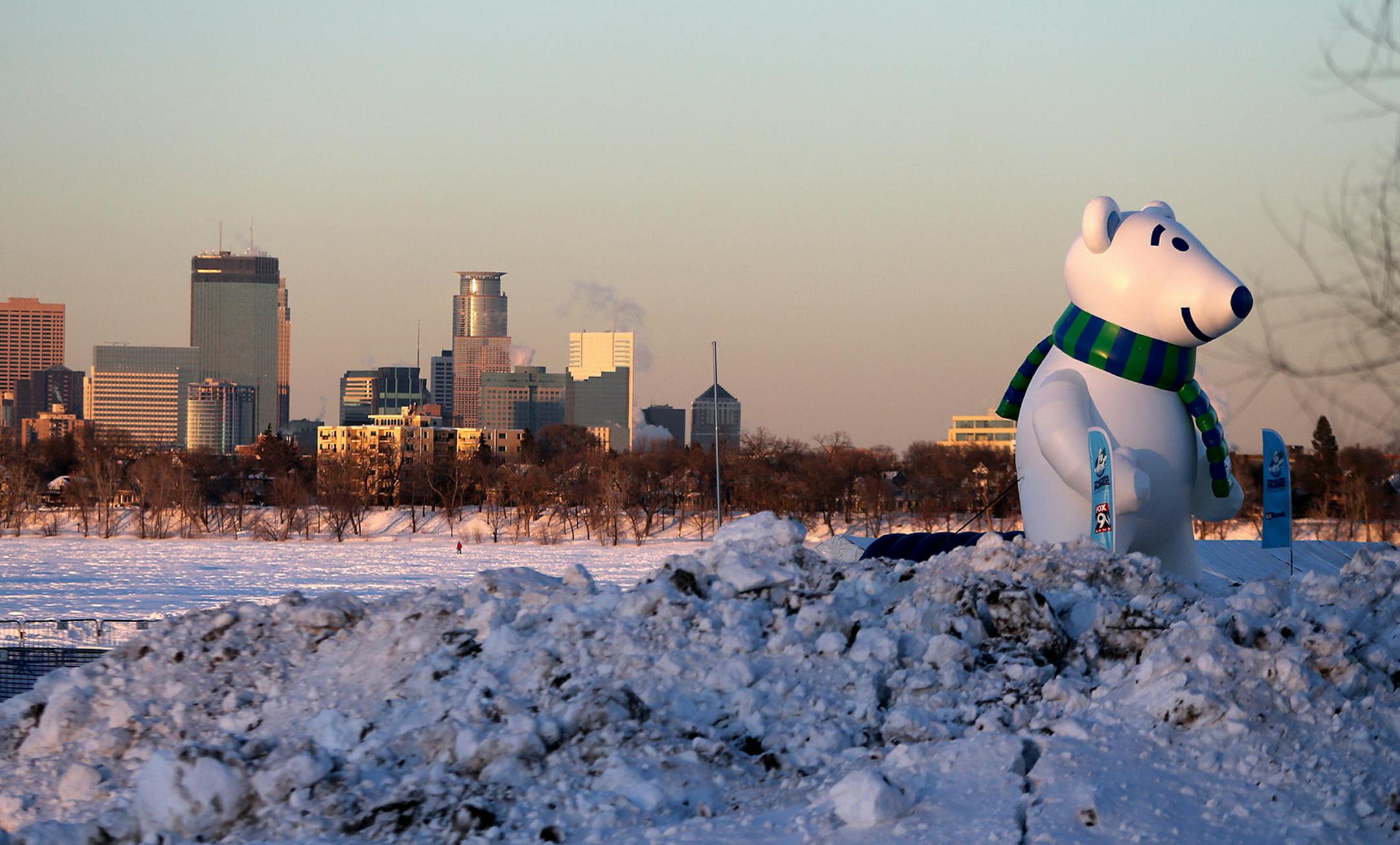 The Minneapolis skyline marks as a background for the huge polar bear that was installed in Lake Calhoun for the upcoming annual event, Thursday, February 27, 2014. The Polar Plunge event is an event that raises money for special olympics. It will take place this weekend at Lake Calhoun. ] ELIZABETH FLORES • eflores@startribune.com
