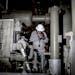 FILE -- A pipeline operator at Southwestern Energy uses an infrared camera to check for gas leaks, in Damascus, Ark., June 28, 2016. Some in the oil a