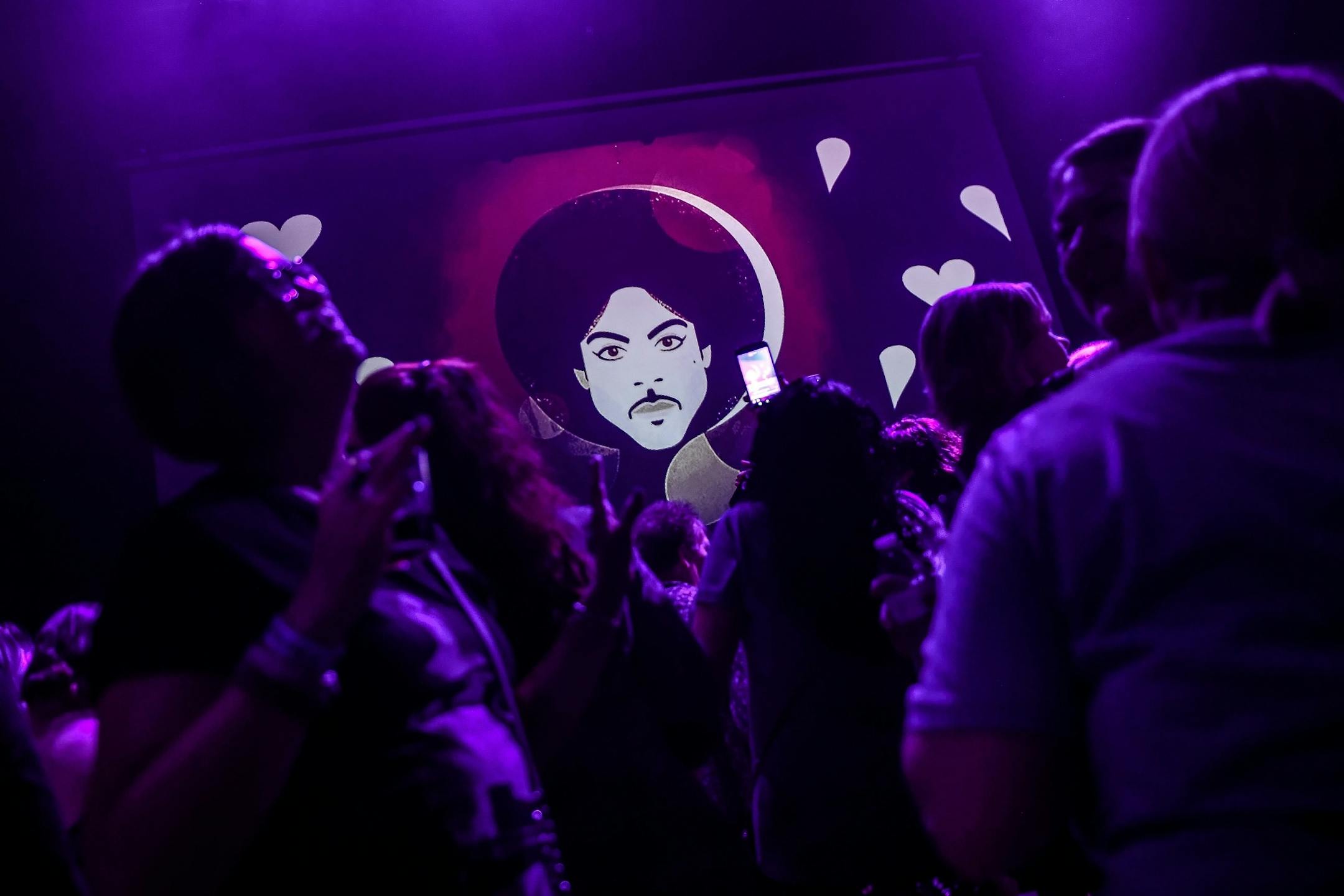 Prince artwork and album covers were projected on a big screen during Friday night's dance party at First Avenue.