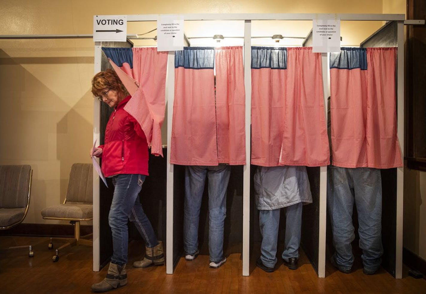 Christine Giroux exits the voting booth at Transit Town Hall, Tuesday, Nov. 6, 2018. At 91.4 percent, in 2016, Sibley County had one of the highest percentage of votes cast at a polling place of any county in the state.