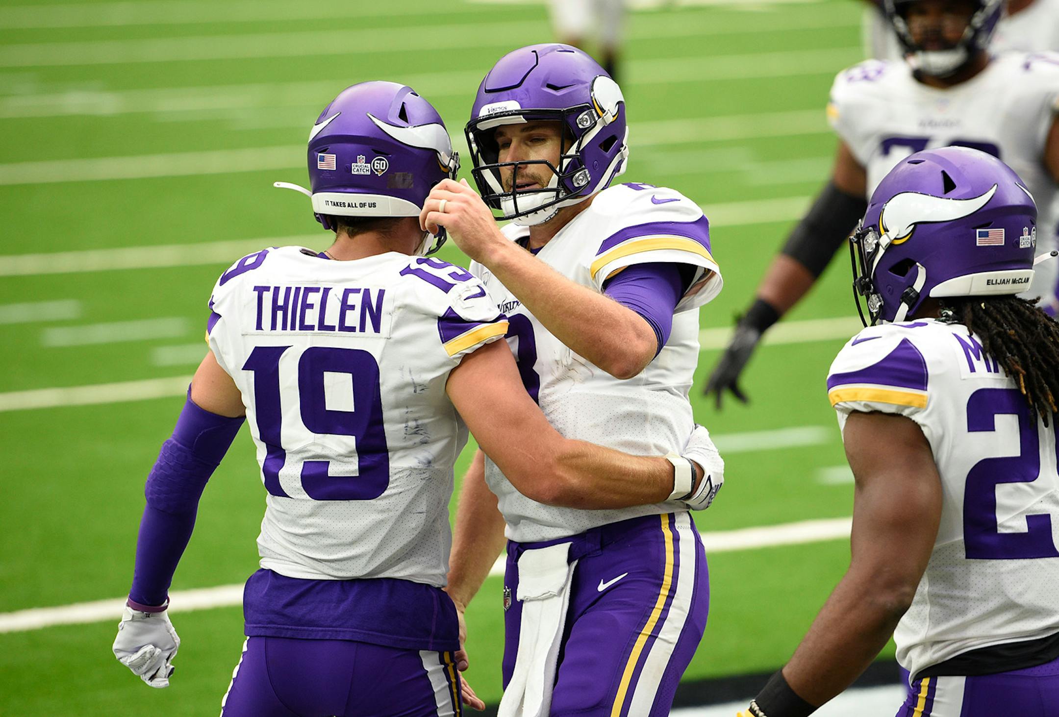 Minnesota Vikings wide receiver Adam Thielen (19) and Minnesota Vikings quarterback Kirk Cousins (8) celebrate after they conned on a pass for a touchdown against the Houston Texans.