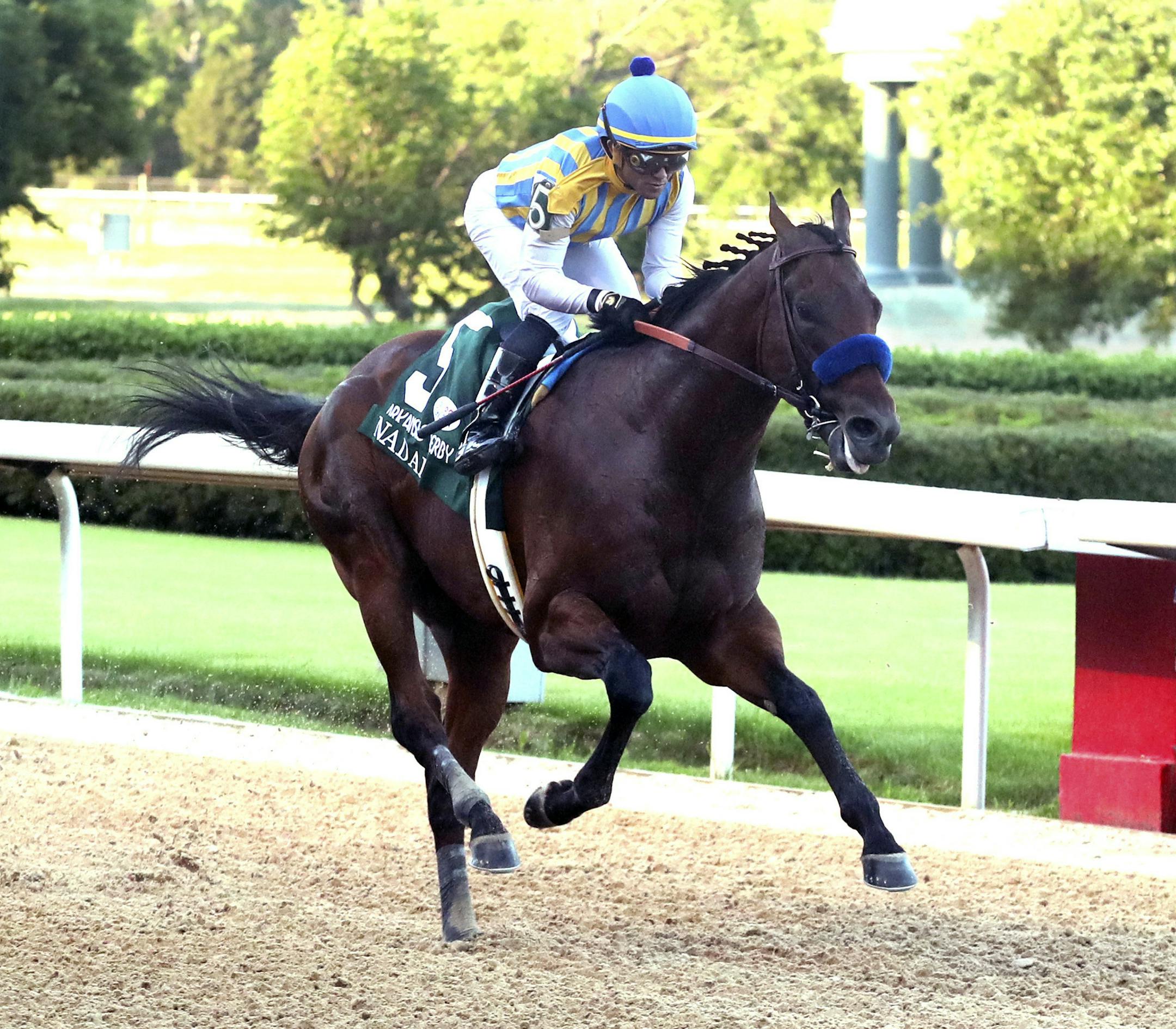 Joel Rosario, top, and Nadal cross the wire to win the second division of the Arkansas Derby horse race Saturday, May 2, 2020, at Oaklawn Racing Casino Resort in Hot Springs, Ark. (Richard Rasmussen/The Sentinel-Record via AP)