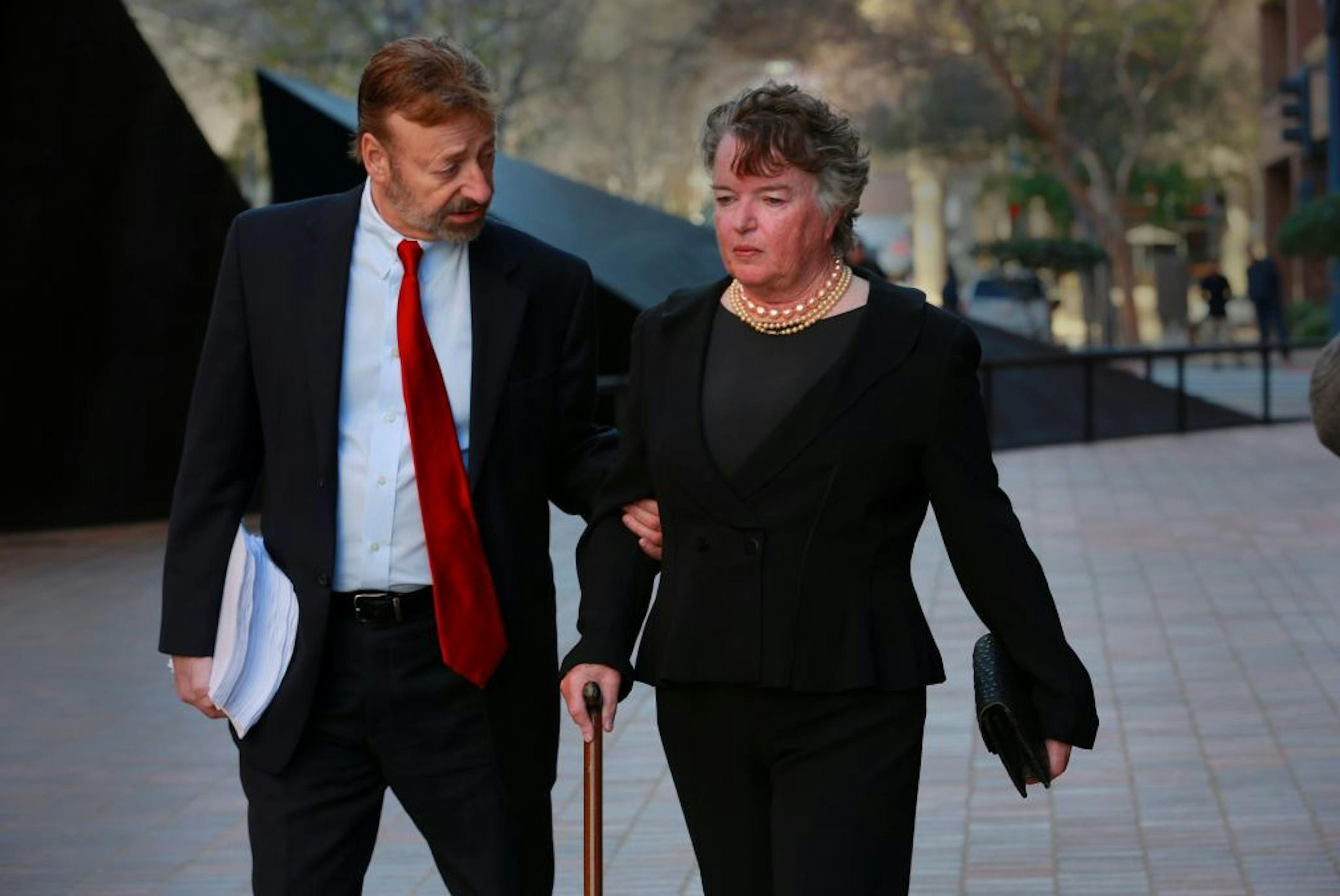 Former San Diego mayor Maureen O'Connor, right, walks to federal court in San Diego, Thursday, Feb. 14, 2013, with her attorney Eugene Iredale. O'Connor admitted in federal court that she misappropriated $2 million from her late husband's charitable foundation due to a gambling addiction in which she won more than $1 billion but lost even more over nearly a decade.