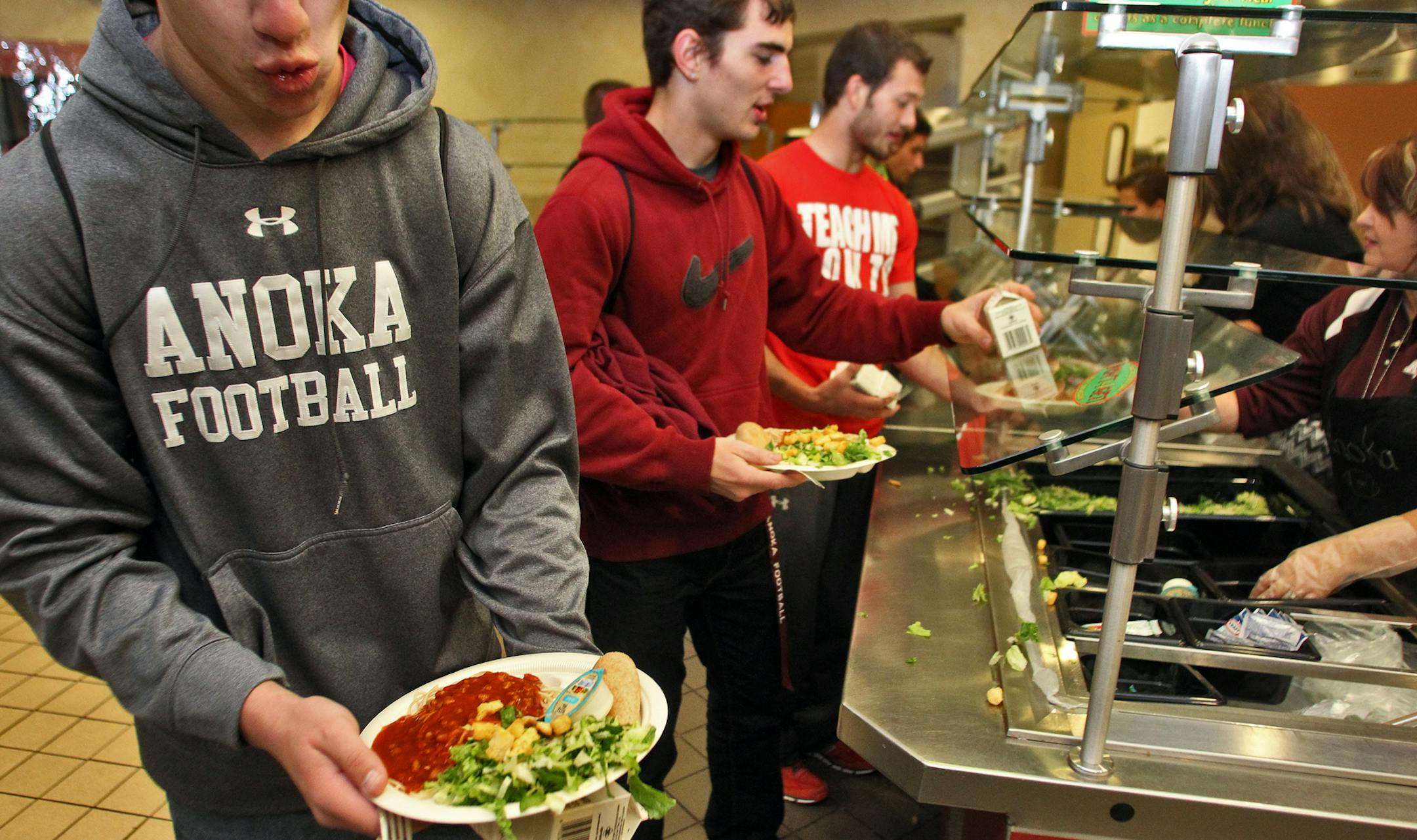 The Anoka Football Boosters Club held their traditional spaghetti dinner for football players in the high school dining room. (MARLIN LEVISON/STARTRIBUNE(mlevison@startribune.com (cq -
