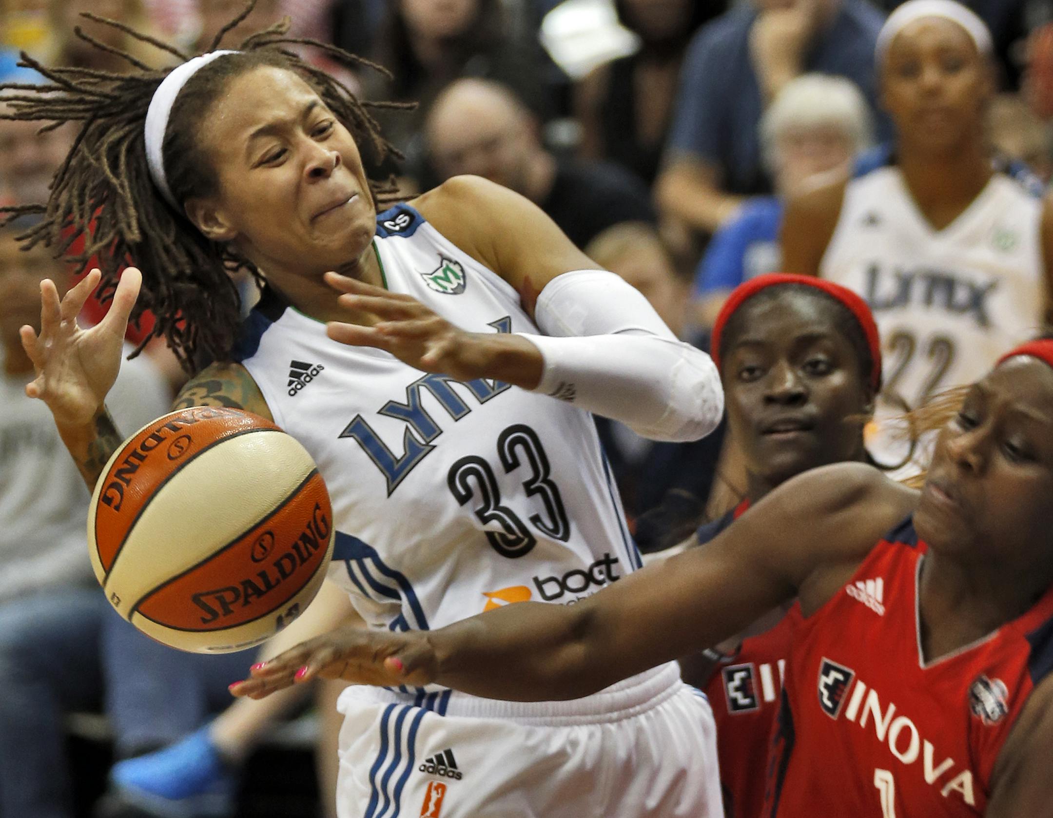 Minnesota Lynx vs. Washington Mystics. Washington won 79-75. Lynx Seimone Augustus (33) was stripped of the ball by Mystics Crystal Langhorne as she drove to the basket. (MARLIN LEVISON/STARTRIBUNE(mlevison@startribune.com)