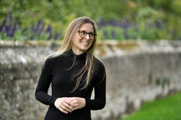 photo of author Kristen Perrin in front of a stone wall