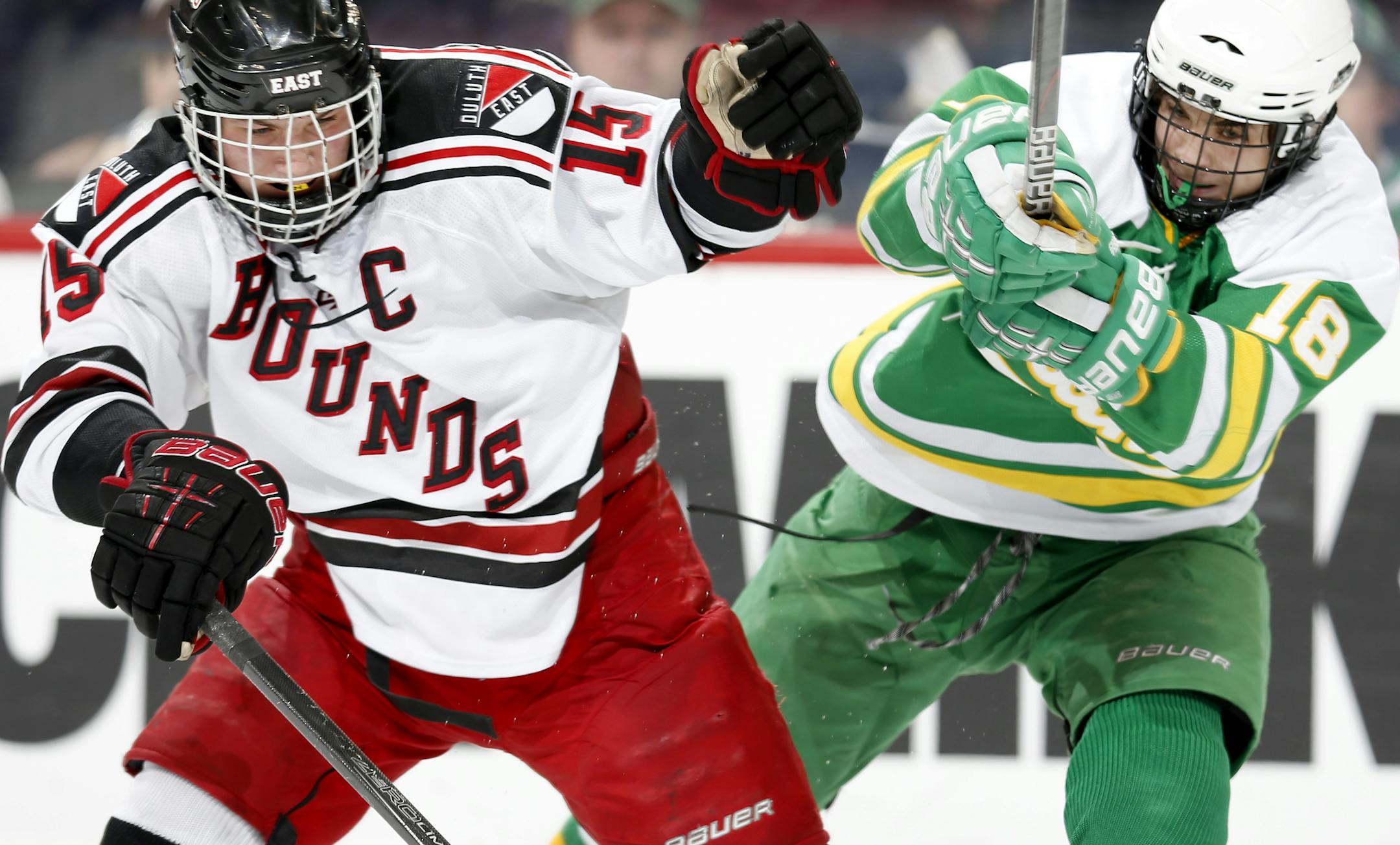 Meirs Moore (15) of Duluth East and Dan Hinueber (18) of Edina in the third period. Edina beat Duluth East by a final score of 3-2. ] CARLOS GONZALEZ cgonzalez@startribune.com - March 8, 2013, St. Paul, Minn., Xcel Energy Center, Minnesota High School Boys State Hockey, 2A Semi Finals, Edina vs. Duluth East