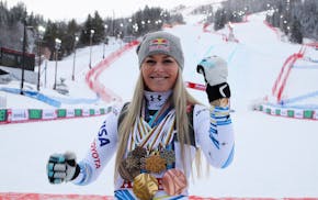 Lindsey Vonn showed off her career medals in 2019 in the finish area after the women's downhill race, at the alpine ski World Championships in Are, Sw