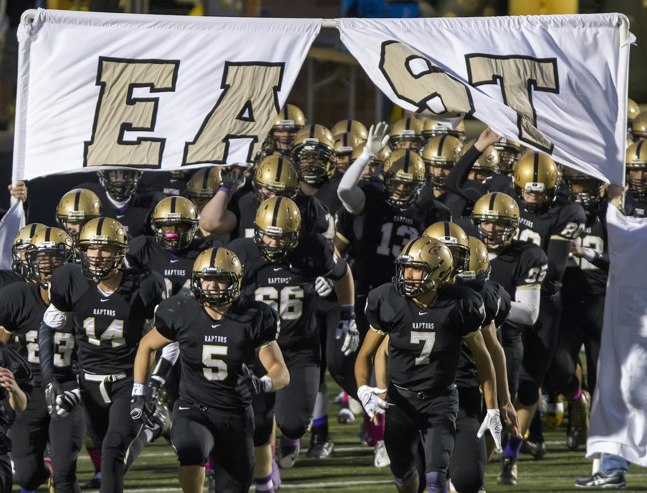 The East Ridge High School Raptors football team takes the field. ] MATT BLEWETT &#xef; matt@mattebphoto.com - October 9, 2015, Woodbury, MN, East Ridge High School, Prep Football, East Ridge Raptors vs. Woodbury Royals, per Tom Wallace
