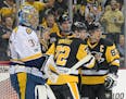 The Penguins' Patric Hornqvist (72) and Sidney Crosby (87) will have a challenge solving goalie Pekka Rinne, left, and the Predators' brilliant corps 