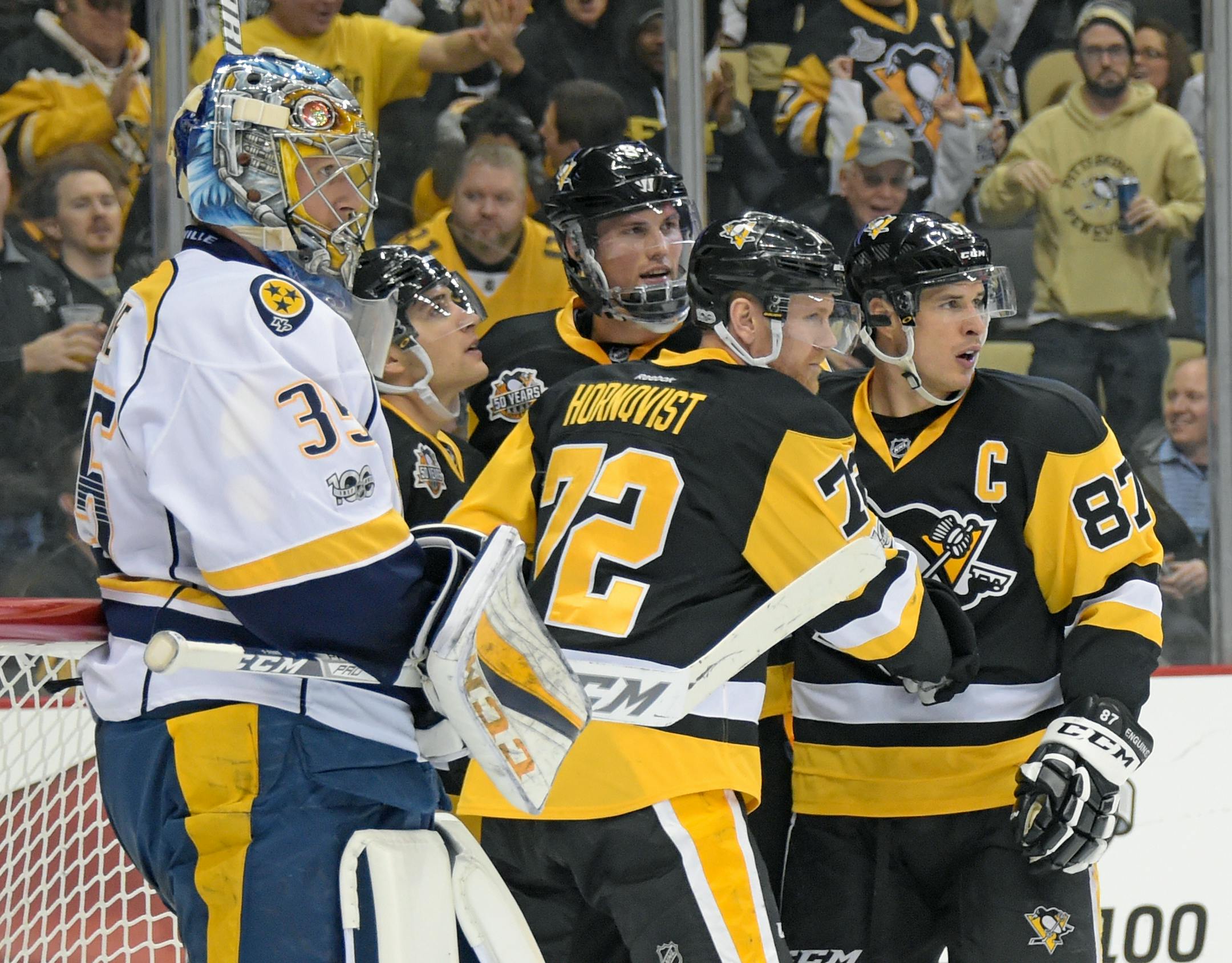 The Penguins' Patric Hornqvist (72) and Sidney Crosby (87) will have a challenge solving goalie Pekka Rinne, left, and the Predators' brilliant corps of defensemen in the Stanley Cup Final.