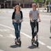 Sophie Konewko and Megan Albers decided to take two Bird scooters for a ride through downtown Minneapolis after lunch. ] GLEN STUBBE &#x2022; glen.stu