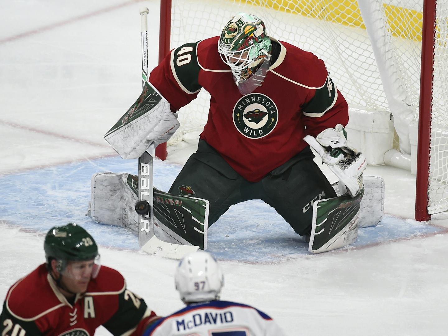 Minnesota Wild's goalie Devan Dubnyk (40) stops a shot by the Edmonton Oilers during the first period of an NHL hockey game, Friday, Dec. 9, 2016, in St. Paul, Minn. (AP Photo/Craig Lassig)