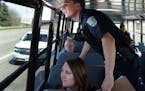 Eagan police officer Luke Nelson strained to get a better look at an offender as he and fellow officers rode a school bus looking for distracted drive