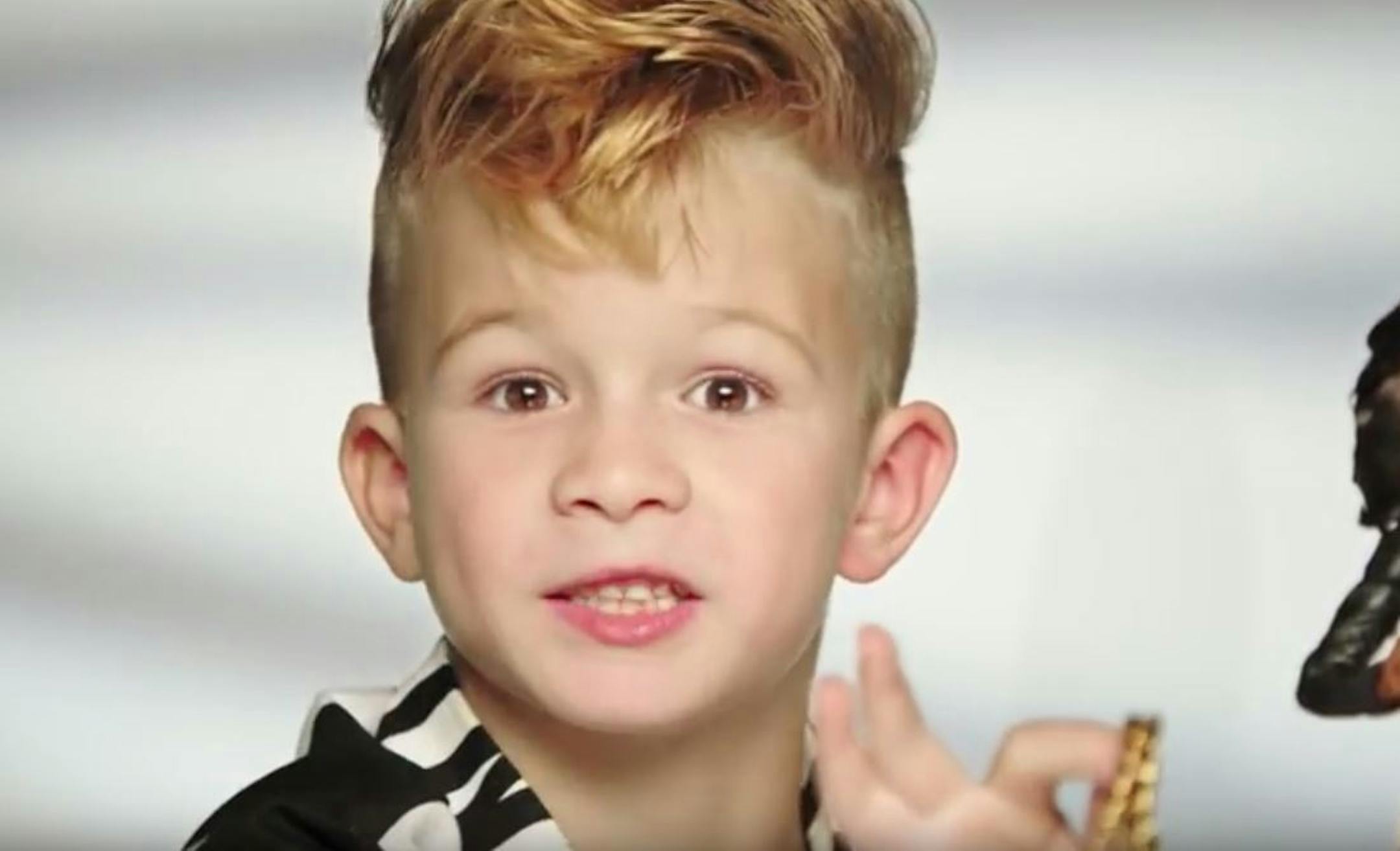 A Barbie commercial posted by designer Moschino on YouTube shows a boy for the first time.
