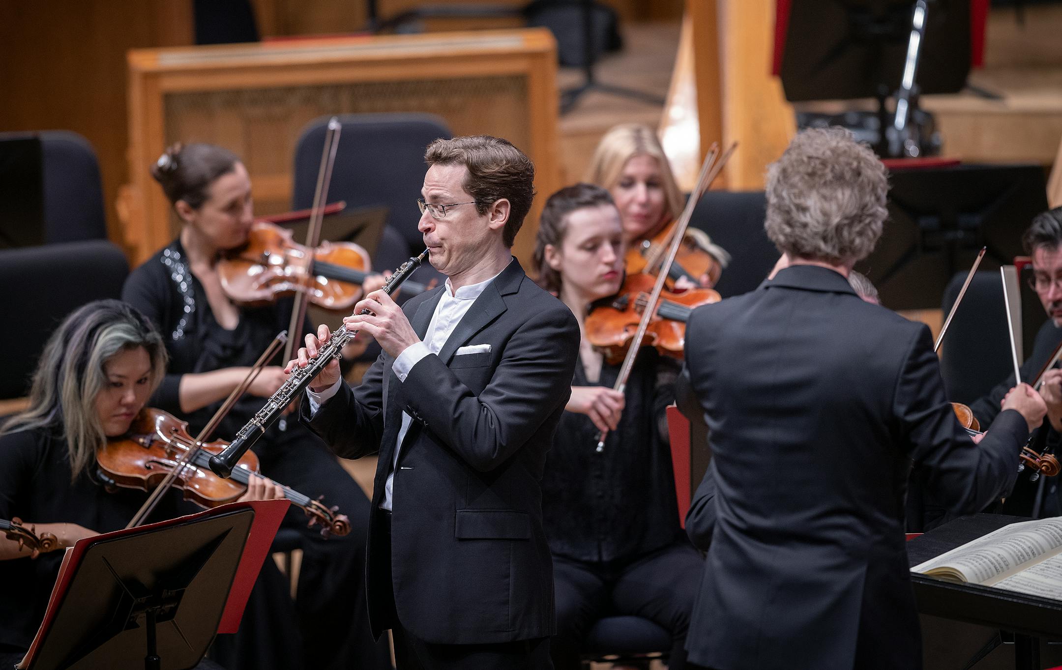 Soloist Nathan Hughes performs alongside Thomas Søndergård during Søndergård's first concert as music director of the Minnesota Orchestra in Minneapolis. The piece was "Oboe Concerto" by composer Wolfgang Amadeus Mozart.