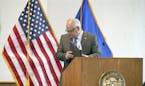 Minnesota Gov. Tim Walz, shown finishing a press conference on coronavirus last week, and other top political leaders are confronting fundamental ethi