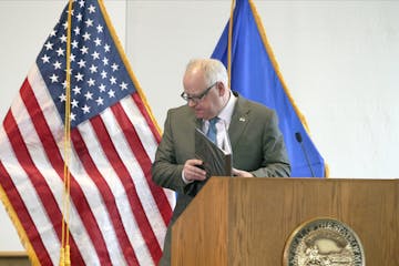 Minnesota Gov. Tim Walz, shown finishing a press conference on coronavirus last week, and other top political leaders are confronting fundamental ethi