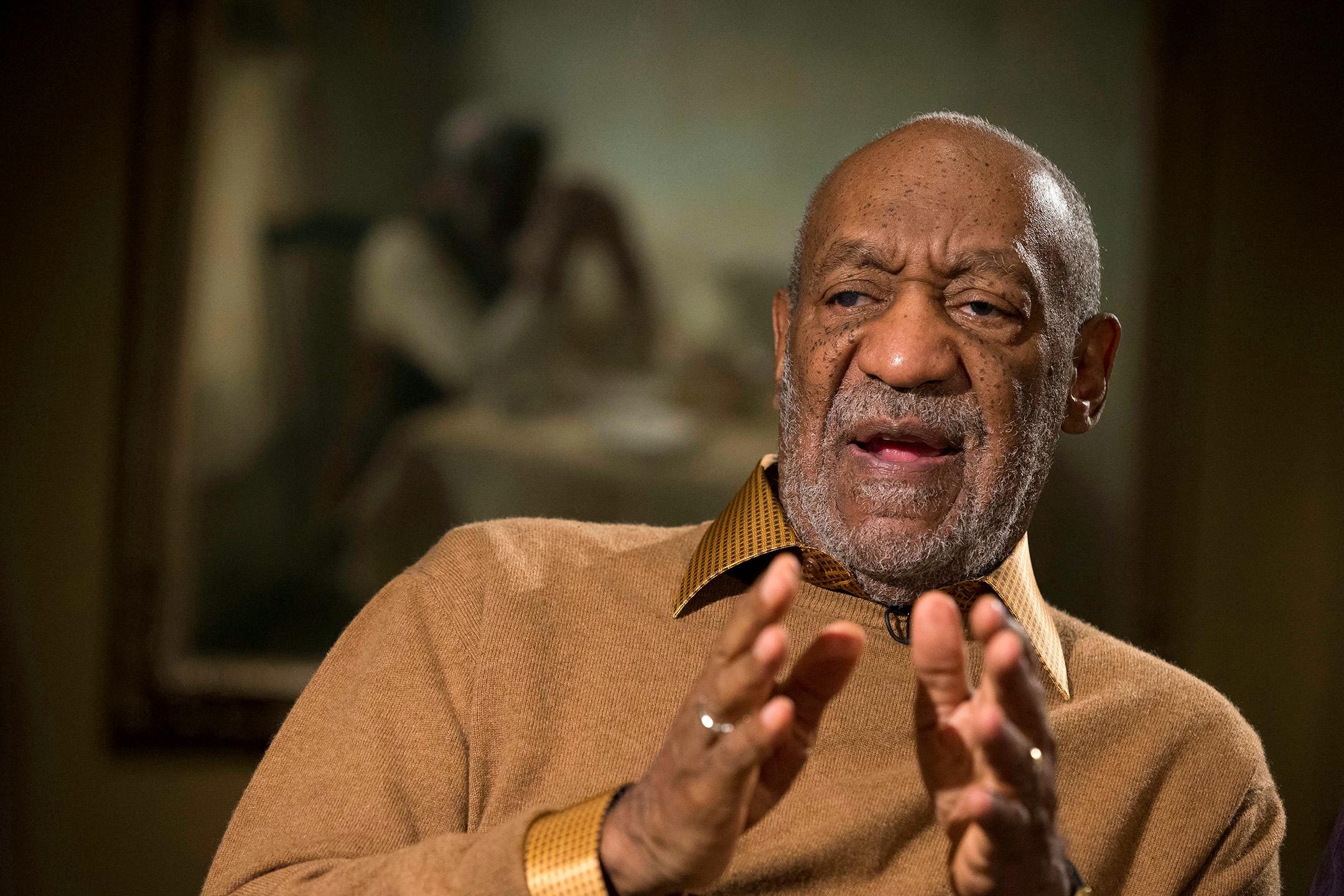 FILE - In this Nov. 6, 2014 file photo, entertainer Bill Cosby gestures during an interview at the Smithsonian's National Museum of African Art in Washington.