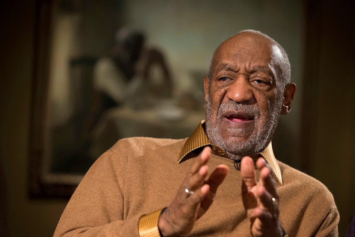 FILE - In this Nov. 6, 2014 file photo, entertainer Bill Cosby gestures during an interview at the Smithsonian's National Museum of African Art in Washington.