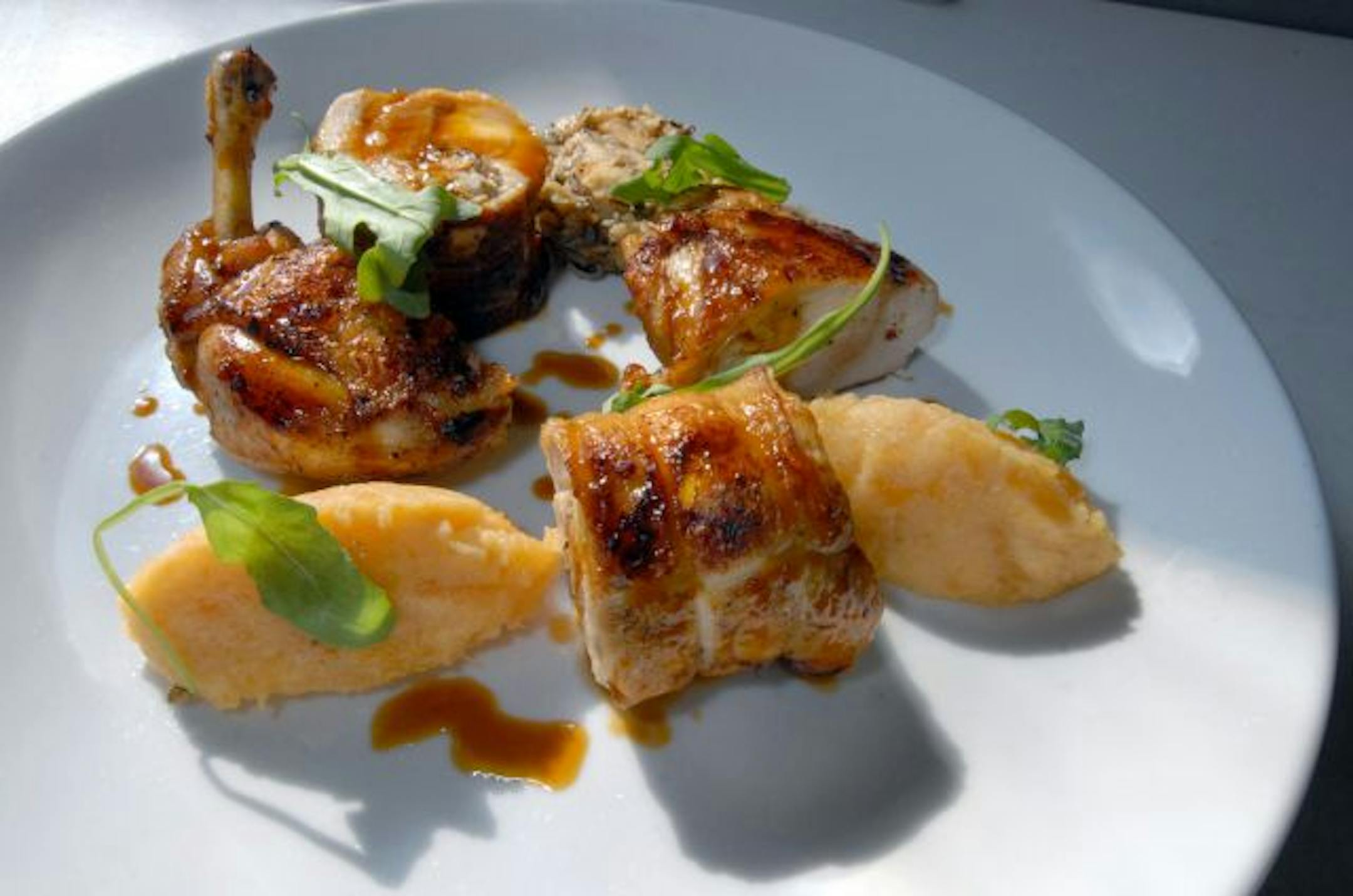 Barbette's roast chicken stuffed with wild rice and apples and served with smashed rutabaga.