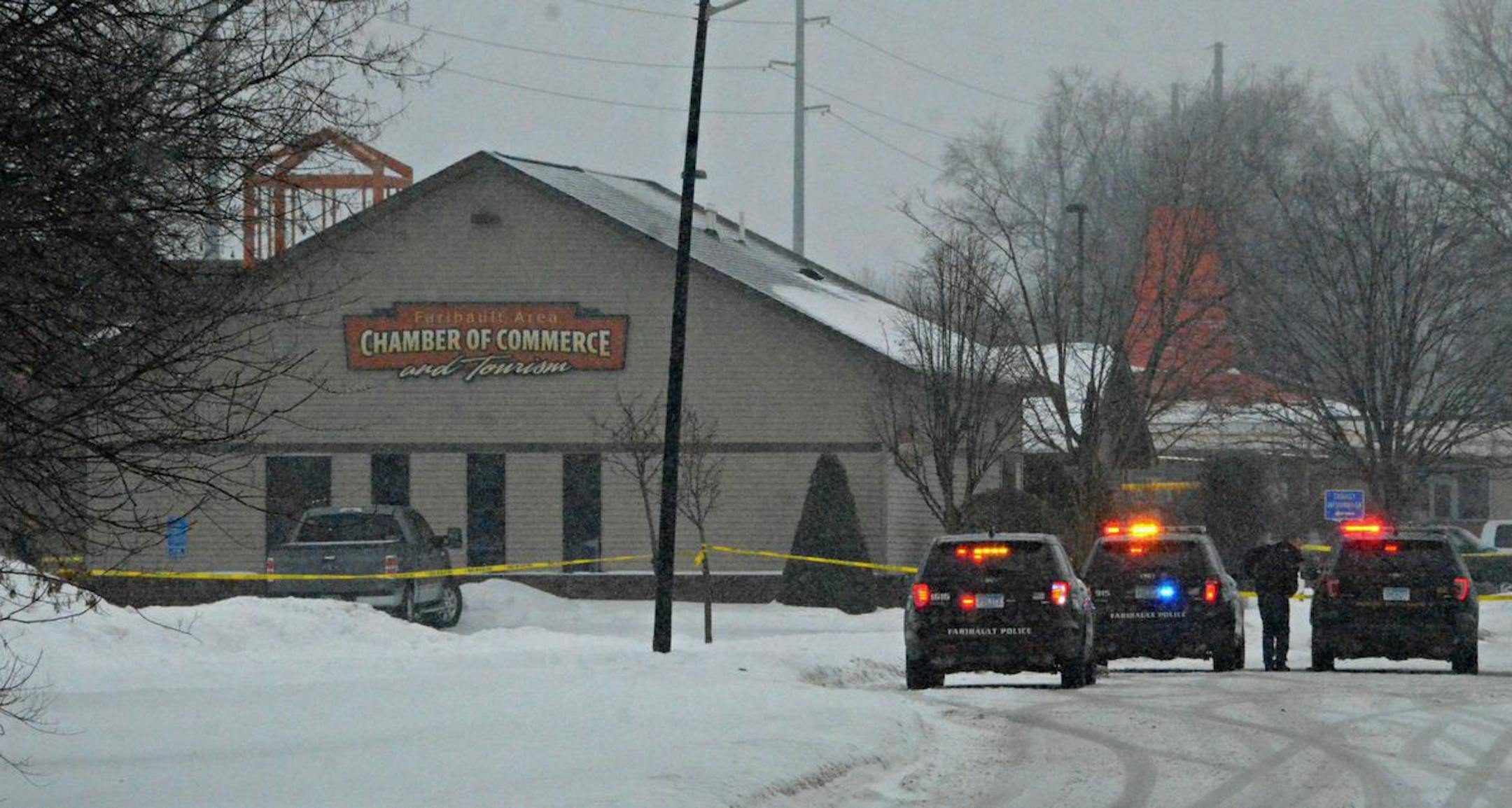 Faribault Police Department officers and other law enforcement agents gathered near the Faribault Chamber of Commerce building, as they investigated an apparent murder-suicide.