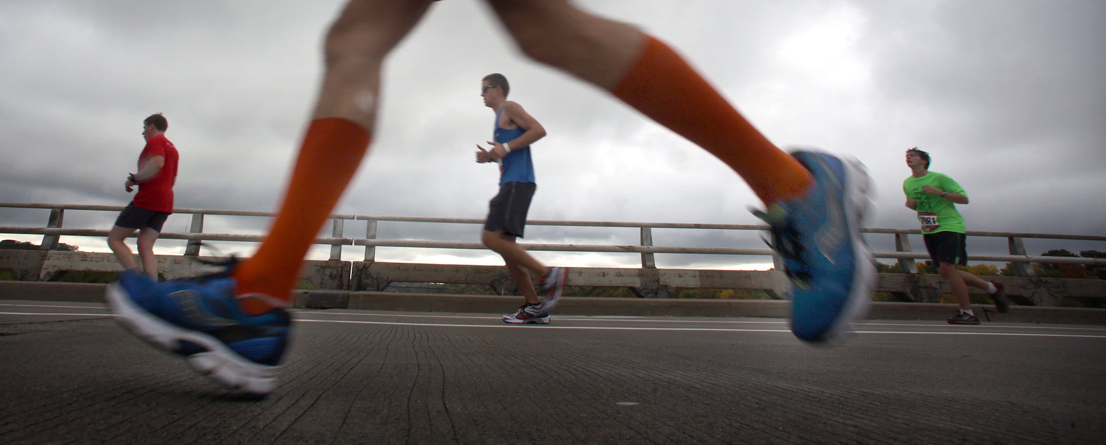 Determined runners crossed the Mississippi River along the Franklin Avenue bridge at the 19-mile mark.