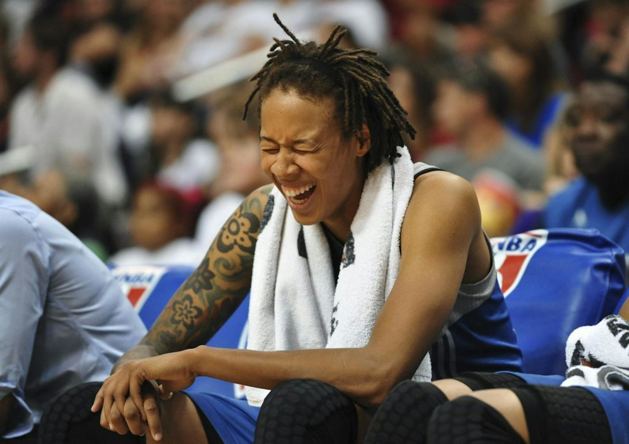 Lynx forward Seimone Augustus laughed Sunday while sitting on the bench late in the second half against the Phoenix Mercury. The Lynx won 96-90.