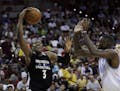 Minnesota Timberwolves' Kris Dunn shoots against the Denver Nuggets during the second half of an NBA summer league basketball game Friday, July 8, 201