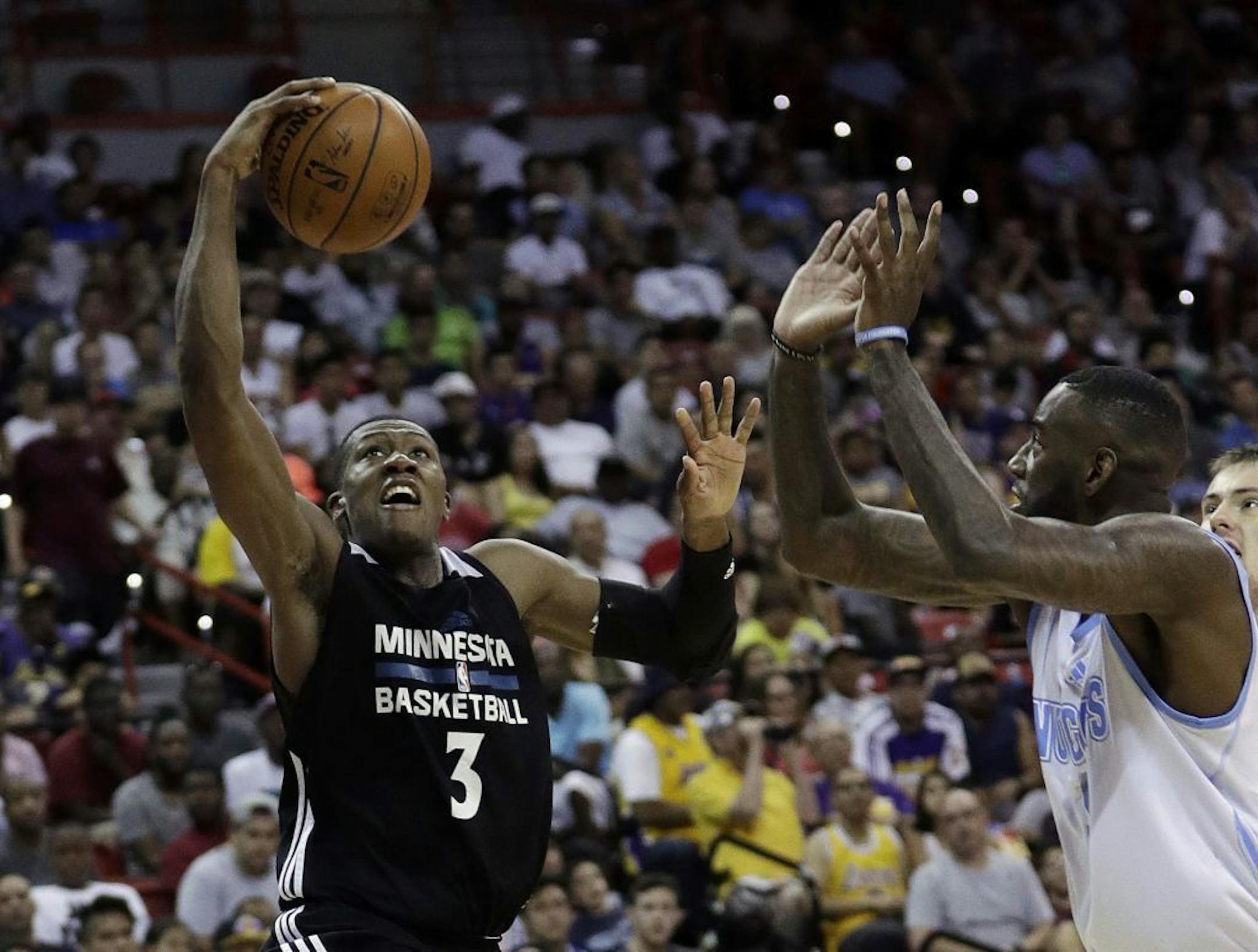 Minnesota Timberwolves' Kris Dunn shoots against the Denver Nuggets during the second half of an NBA summer league basketball game Friday, July 8, 2016, in Las Vegas.