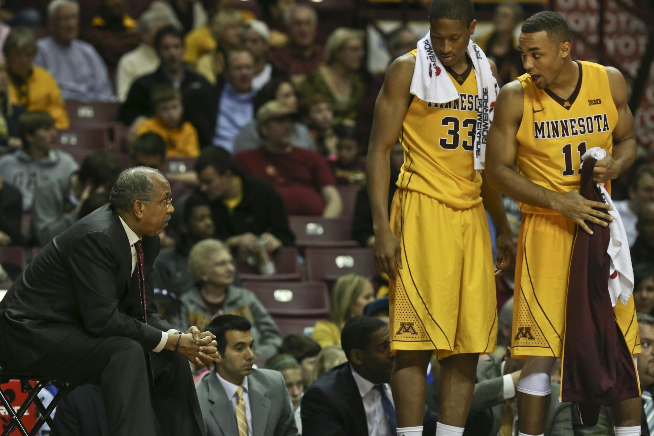 Gophers Rodney Williams Jr. and Joe Coleman talked to coach Tubby Smith.