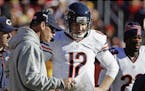 FILE - In this Oct. 20, 2013 file photo, Chicago Bears quarterback Josh McCown talks with head coach Marc Trestman during an NFL football game against