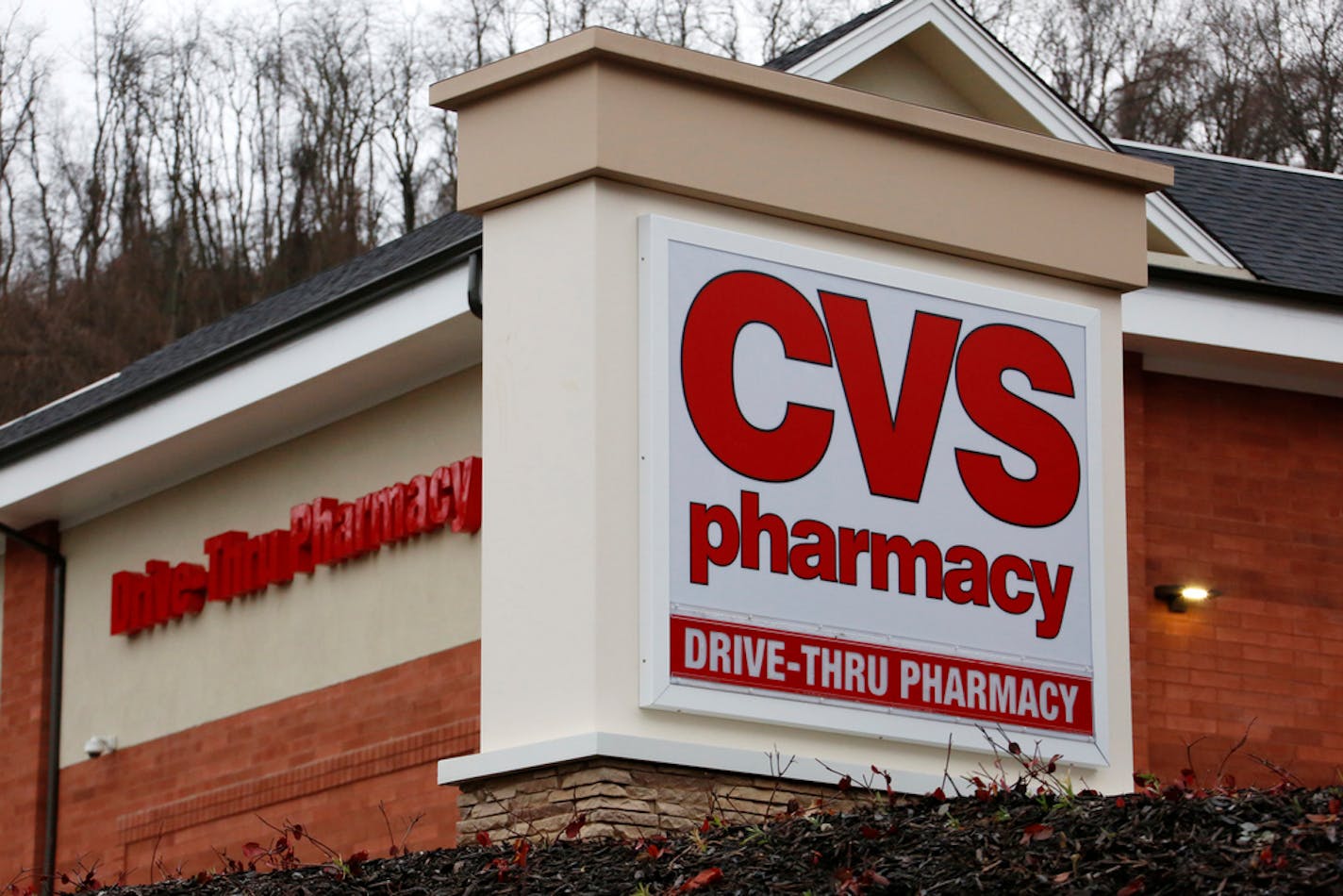 FILE - This Jan. 18, 2017, file photo shows a CVS Pharmacy in Pittsburgh. CVS Health is expanding same-day prescription deliveries nationwide in the latest push by drugstores to keep customers who don't want to wait and are doing more shopping online. (AP Photo/Gene J. Puskar, File)