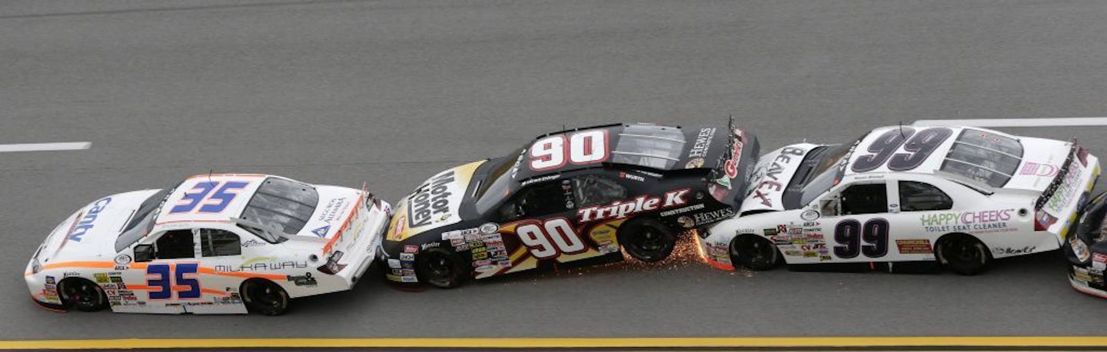 Grant Enfinger (90) gets crunched between Milka Duno (35), of Venezuela, and Mason Mitchell (99) in Turn 2 in a crash during the ARCA race at Talladega Superspeedway on May 3.
