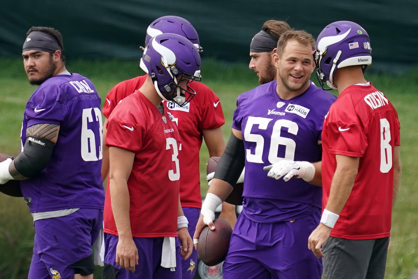 Vikings center Garrett Bradbury (56) joked with quarterback Kirk Cousins (8) during training camp Thursday. ] ANTHONY SOUFFLE • anthony.souffle@startribune.com