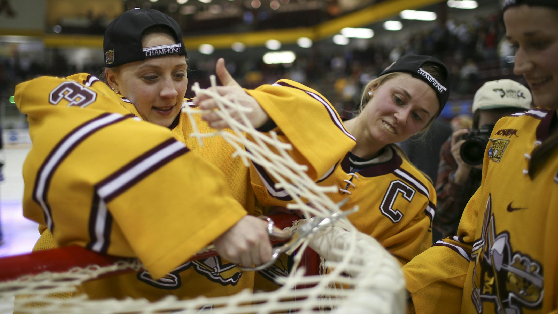 Minnesota Shyler Sletta (31) cut a piece from the net after the Gophers' national championship win Sunday afternoon at Ridder Arena. ] JEFF WHEELER ï jeff.wheeler@startribune.com The University of Minnesota women's hockey team beat Harvard 4-1 for the NCAA Women's Frozen Four Championship Sunday afternoon, March 22, 2015 at Ridder Arena in Minneapolis.