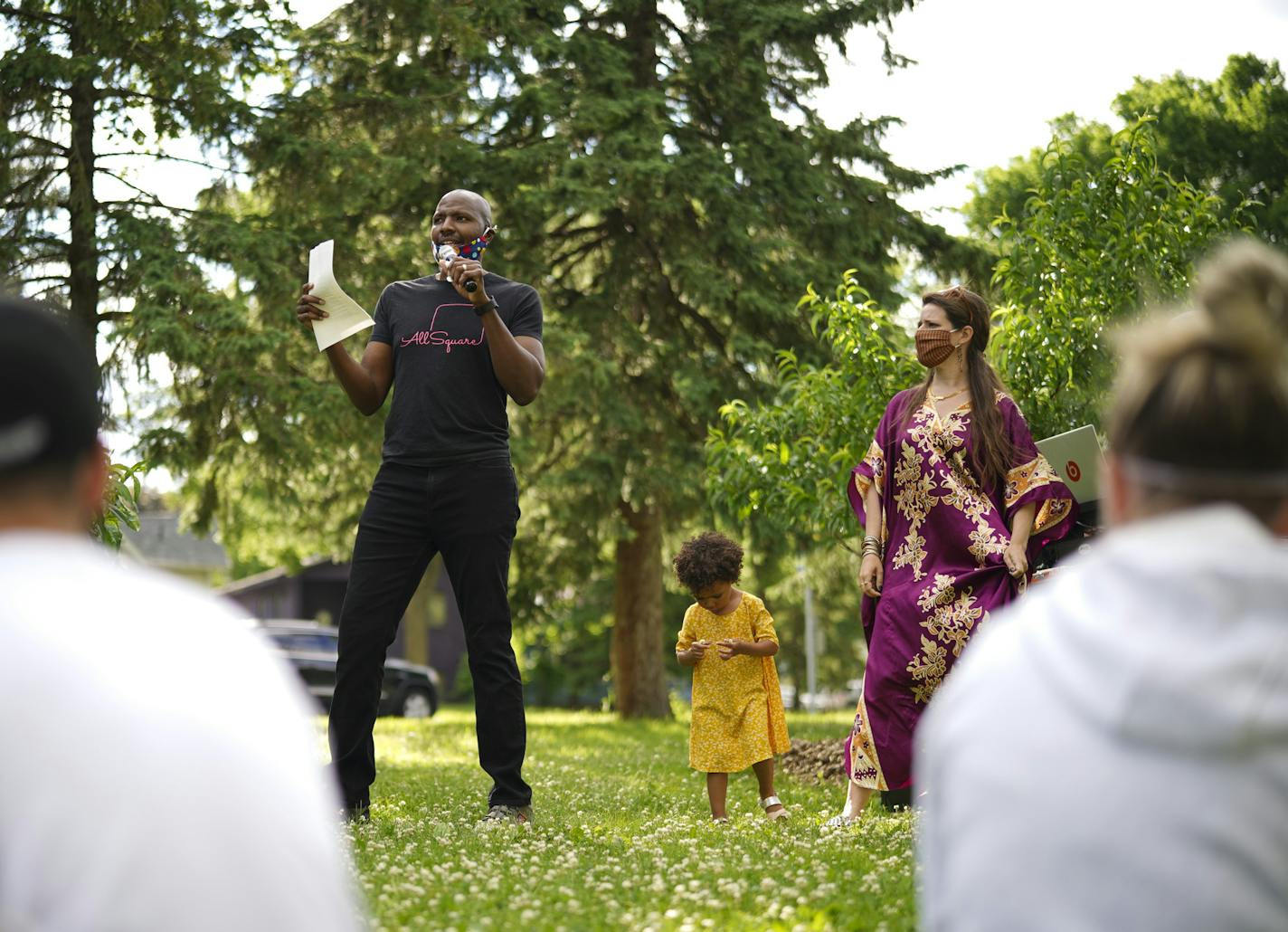 Jamil and Sara Stamschror-Lott at the beginning of a community healing session in Adams Triangle park. With them was their daughter, Zola.