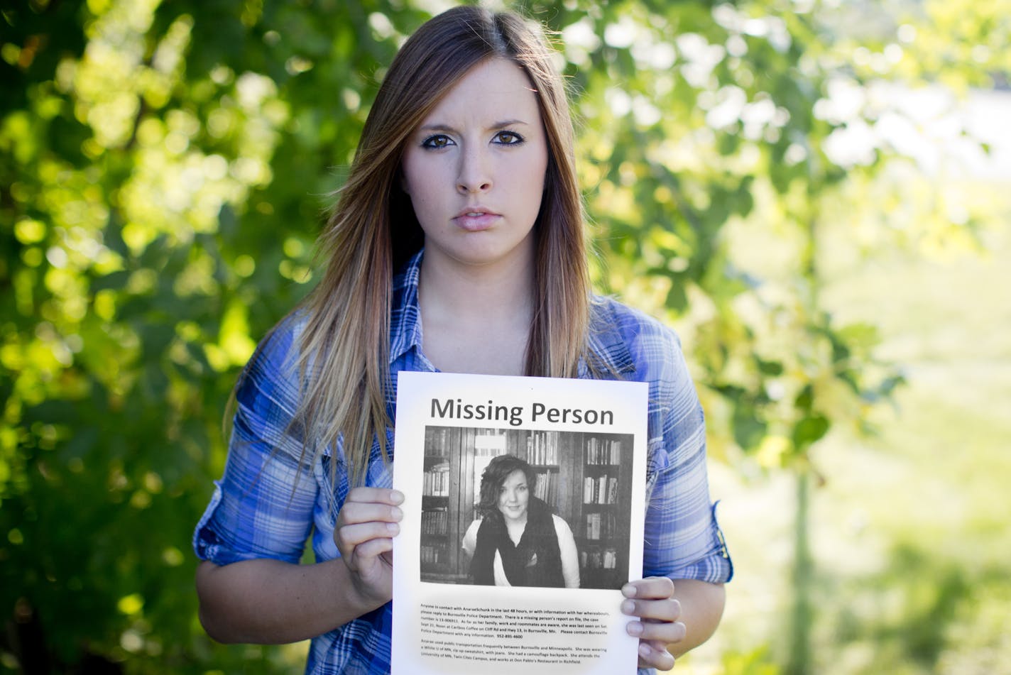 Sarah Chacos held a missing poster sign of her friend Anarae Schunk who was last seen in the early hours of Sunday morning. Sarah was photographed at the last place she saw her friend in Burnsville, Minn., on Tuesday, September 25, 2013.