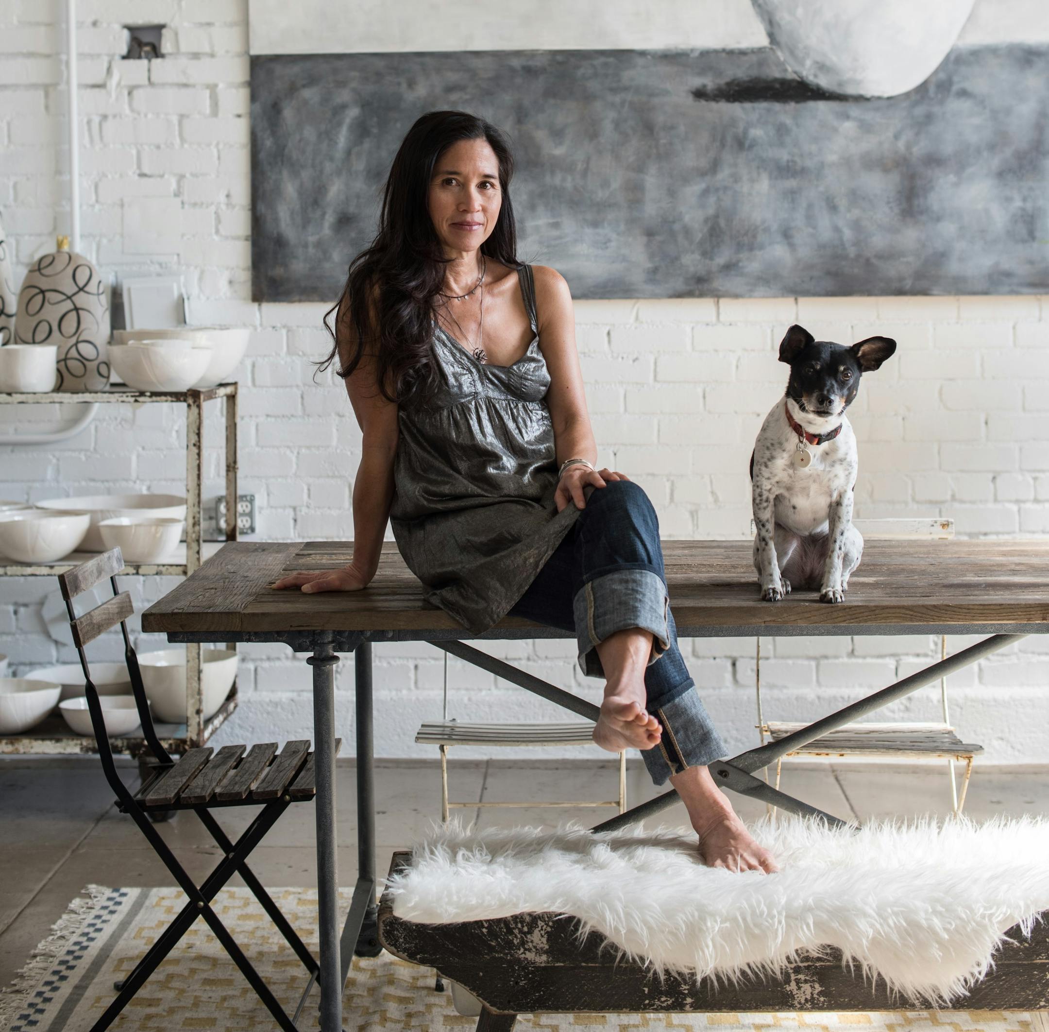 Rae Dunn with her Jack Russell terrier, Wilma, at her studio in Berkeley, Calif., March 1, 2015. Dunn has attracted many admirers with her intentionally imperfect handmade ceramic pieces, but if you thought her first book, 'Wilma's World,' would be about ceramics, you'd be mistaken. (Drew Kelly/The New York Times)