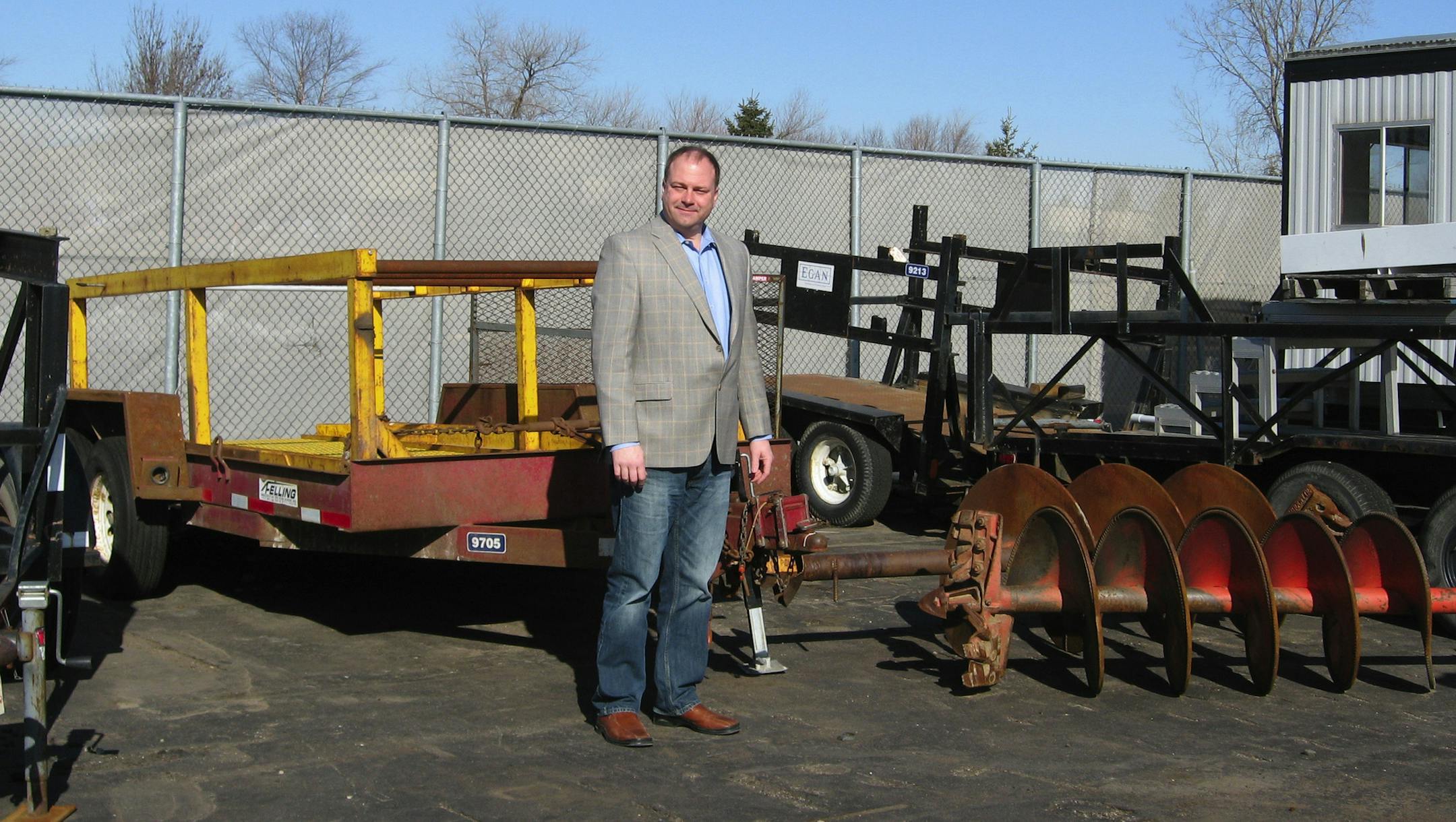 w/ nojobs041013. Pix cutlines, Photo by Jim Adams Greg Koetz, of Egan Companies, stands next to the firm‚Äôs outdoor storage area, which was outlawed until the city revised its business park zoning rules to permit a certain amount of outside storage. Egan had begun to look for new space elsewhere when the city found a way to allow the storage, which had been allowed only in industrial zoned areas.