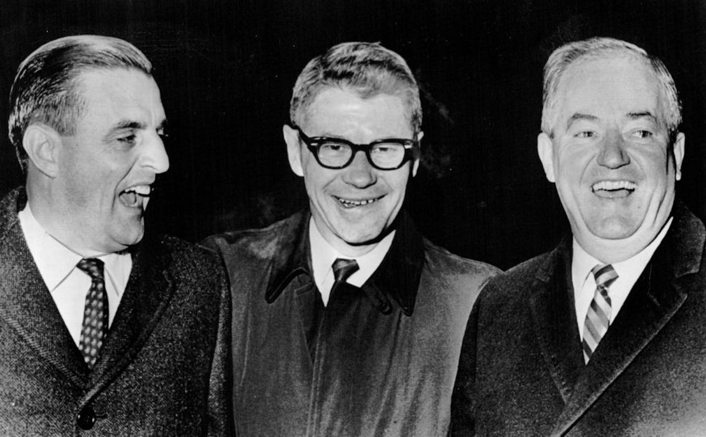 Walter Mondale, left, greeted Orville Freeman and Vice President-elect Hubert Humphrey at a Grain Terminal Association banquet in St. Paul in on Nov. 20, 1964.