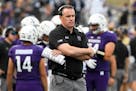 FILE - In this Sept. 2, 2017, file photo, Northwestern coach Pat Fitzgerald stands near the sideline during the second half of the team's NCAA college