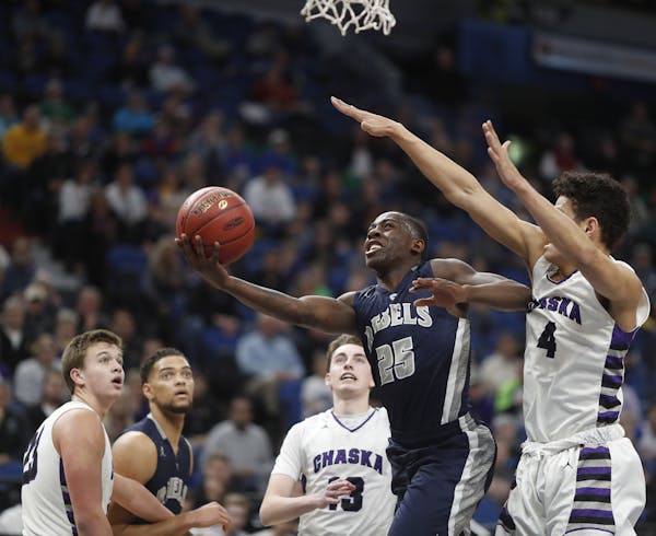McKinley Wright of Champlin Park scored over Chaska's Myles Hanson during quarterfinal class 4A basketball action at Target Center Wednesday March 22 