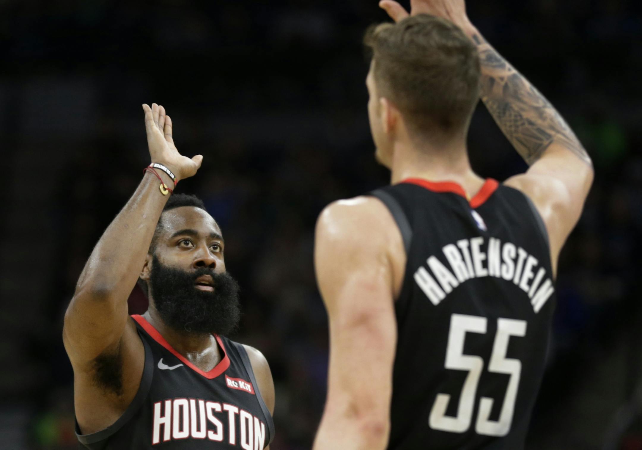 Houston Rockets guard James Harden is congratulated by Houston Rockets center Isaiah Hartenstein (55) in the fourth quarter during an NBA basketball game against Minnesota Timberwolves Saturday, Nov. 16, 2019 in Minneapolis. The Rockets defeated the Timberwolves 125-105 with Harden scoring a game-high 49 points.